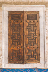 Beautiful handmade door in the Sultanahmet mosque. Handmade wooden door in the courtyard of the blue mosque. Ancient door
