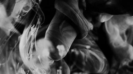 dark dramatic background with slow motion white liquid substance