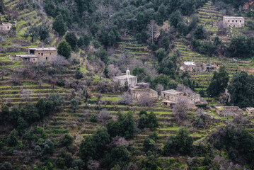 Fototapeta na wymiar Small church and old cottages in Kadisha Valley also spelled as Qadisha in Lebanon