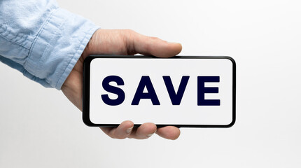 Man's hand holding a smartphone horizontally with text SAVE on white background