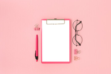 Layout with clipboard mockup and stationery on a pink background. Cute back to school concept.