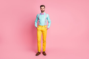 Full length body size view of his he nice attractive imposing elegant trendy fashionable content bearded guy artist holding hands in pockets isolated over pink pastel color background