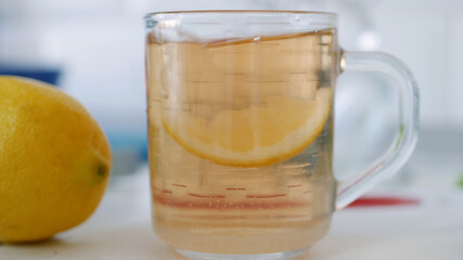 Fresh Sweet and Hot Cup with Tea and a Slice of Lemon at Breakfast Time in the Morning