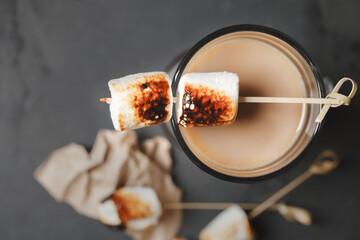 Traditional fall and winter cocktails, alcohol. Campfire hot chocolate cocktail with roasted marshmallow. Cocoa latte marshmallow 