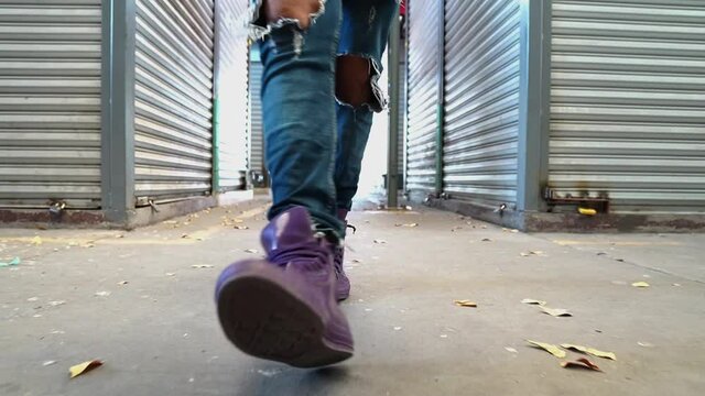 Man in Purple Sneaker walking on isolated place