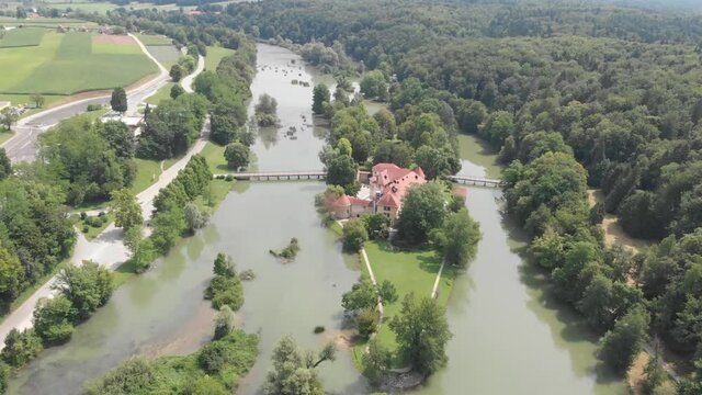 Castle in Otočec, Slovenia. Aerial view of castle in Otocec. Castle on the island in the middle of the river stream. Slovenian fortress surrounded by a river.
