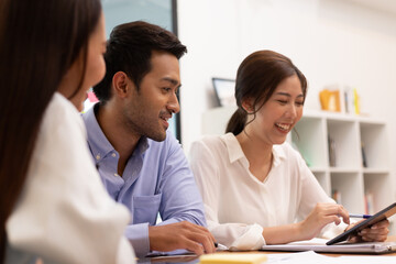 Asian business man and women meeting and talk about job in office.