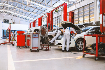 car in automobile repair service center with soft-focus and over light in the background