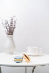 macarons on background Cup and vase with lavender.
