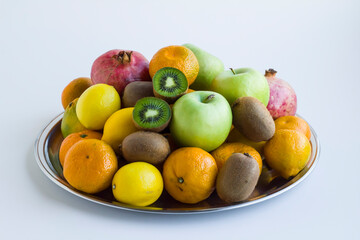 Fresh,ripe group of fruits in metal tray on white,close up