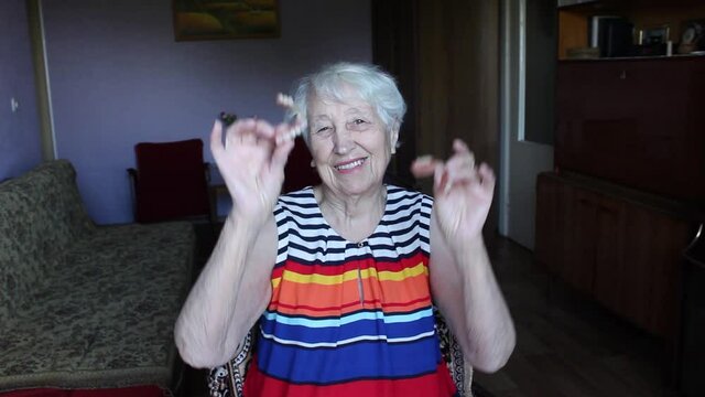 The flexible nylon dentures in senior female hands. Dental concept