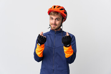 Young cyclist blonde man isolated on white background making money gesture