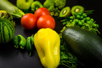 Vegetables and fruits on a black background