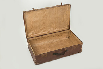 Old brown retro suitcase on a white background
