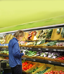 Supermarket shopping,  gloves,man buying vegetables at the market	