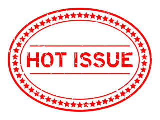 Grunge red hot issue word oval rubber seal stamp on white background