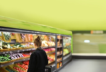Supermarket shopping,  gloves,woman buying vegetables at the market	