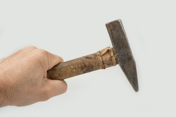 Old used hammer on a white background