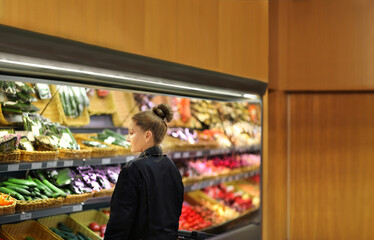 Supermarket shopping,  gloves,woman buying vegetables at the market	