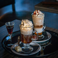 Coffee latte whipped cream with caramel and liquor and bonbon