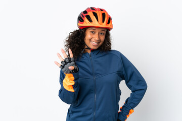 Teenager cyclist woman isolated on white background happy and counting four with fingers