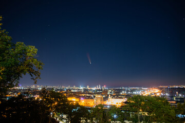 Comet C/2020 F3 (NEOWISE). Aerial view of night city. Kyiv, Ukraine.