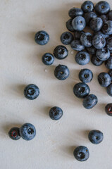 Fresh blueberry on a grey table. Concept for healthy eating and nutrition. Antioxidant organic superfood