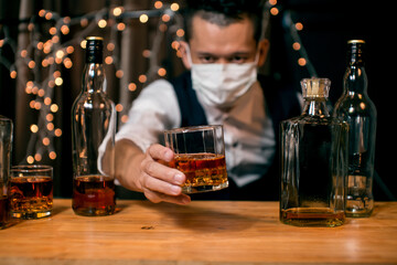 Barman pouring whiskey whiskey glass beautiful night