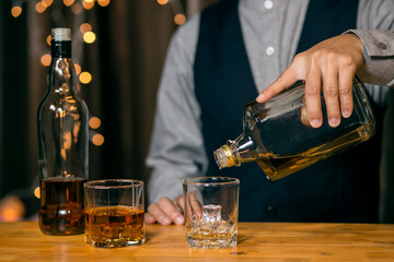 Barman pouring whiskey whiskey glass beautiful night