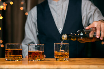 Barman pouring whiskey whiskey glass beautiful night