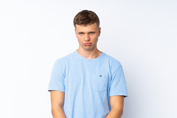 Obraz premium Young handsome man over isolated white background with sad and depressed expression