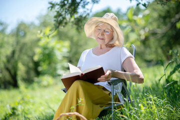 Woman reading a book in the fresh air
