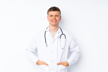 Young handsome man over isolated white background with doctor gown