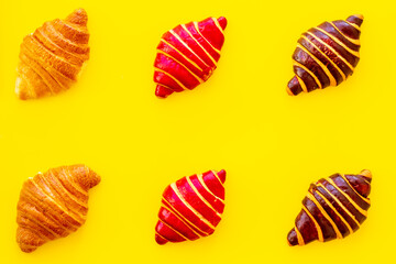 Croissants pattern - set of snacks on yellow background