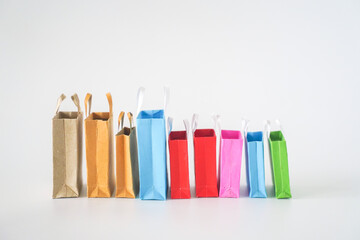 Colorful shopping bags on white background. Shopping service on online web and offers home...