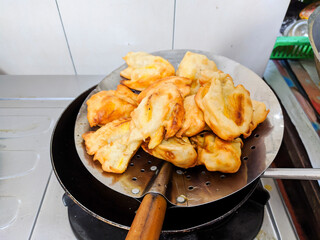 fried bananas. fast food, made from a mixture of flour and banana. deep fried with hot oil.