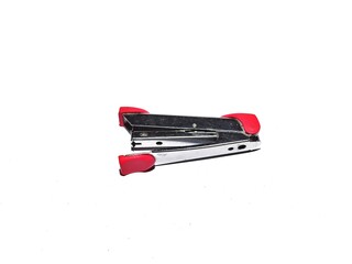 Pink stapler and staples isolated on white background. Office work equipment concept