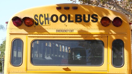 Yellow iconic school bus in Los Angeles, California USA. Classic truck for students back view....