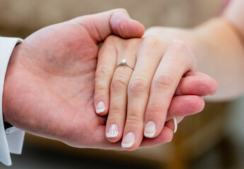 bride and groom holding hands