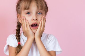 Cute Little Girl Covering Her Mouth Showing Intense Expression of Fear and Terror, Isolated