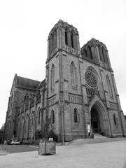 Saint-Germain Church. Beautiful neogothic style religious monument inspired by the famous Catholic Cathedral Notre-Dame-de-Paris. Two towers and a rose window
Shot in black and white, vertical.