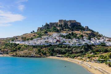 Fototapeta na wymiar Lindos with the castle above on the Greek Island of Rhodes, Greece
