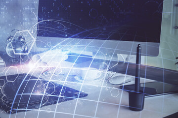 Multi exposure of table with computer and world map hologram. International data network concept.