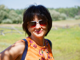 portrait of a brunette girl in sunglasses