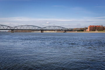 Jozef Pilsudski Bridge over River Vistula in Torun city, Poland - obrazy, fototapety, plakaty