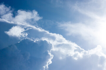 Naklejka na ściany i meble White cloud on blue sky abstract background with sunlight. Concept for freedom, environment,space for text and quote.