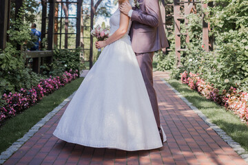 Fototapeta premium bride and groom in the park together at wedding