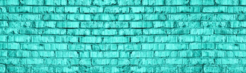 Bright mint color brick wall texture. Light aquamarine old shabby masonry. Teal brickwork widescreen abstract background