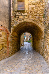 Fototapeta na wymiar Narrow street in the old town of Peratallada (Catalonia, Spain)