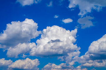 White bright contrasting clouds on blue sky